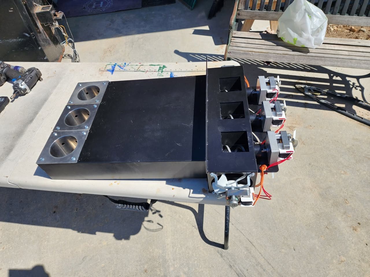 NEW Com200™ triple-auger box assembly with three auger chutes and motors
