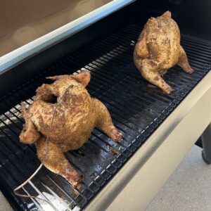 Chicken cooking on a pellet grill (placeholder)